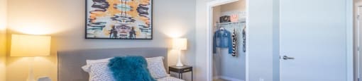 a bedroom with a bed and two lamps