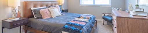 a bedroom with a bed and a desk
