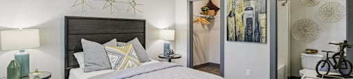 Bright bedroom with large windows, ceiling fan, and simple decor at Lotus at Starkey Ranch in Odessa, Florida.