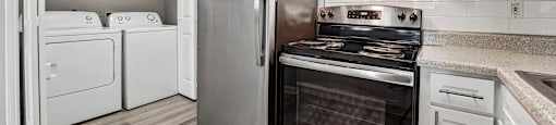 A modern kitchen with stainless steel appliances and white cabinets.