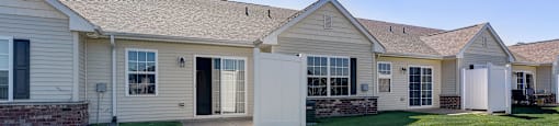a white house with a yard and grass
