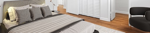a bedroom with a bed and a chair in a 555 waverly unit