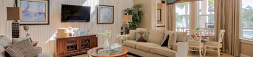 Hinesville, GA Apartments – Tattersall Village - clubhouse with sitting area and tv