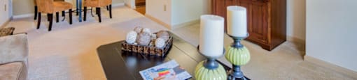Pet-Friendly Apartments in Hinesville, GA – Tattersall Village - living room with plush carpeting and view of dining room and kitchen