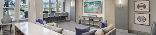 Media room with large screen, comfortable seating, and ambient lighting at Lotus at Starkey Ranch in Odessa, Florida.