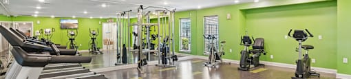 A gym with treadmills and exercise bikes.