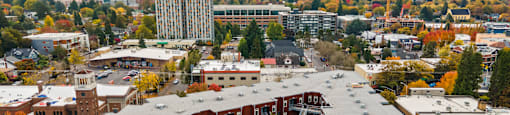 A large building with a parking lot in front of it.