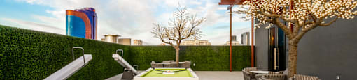 A patio with a table, chairs, and a tree with lights.