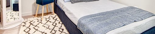 One-Bedroom Apartments In Bothell, WA - 98th Avenue - Bedroom With Luxury Vinyl Plank Flooring