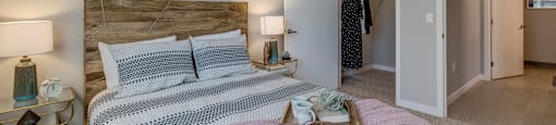 Tigard, OR Apartments for Rent - Sygnii - Bedroom with Carpet Flooring, a Spacious Closet, and a Ceiling Fan