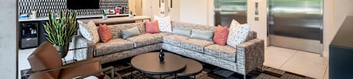 a living room with a couch and a table
