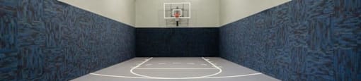 a basketball court in an empty gym