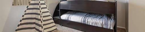 One Bedroom Apartments in Mesa AZ - Mesa Station - Bedroom with Carpet Flooring and a Large Window