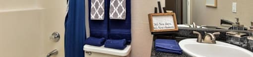 a bathroom with a toilet sink and a mirror