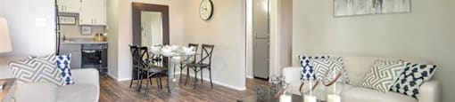 Two Bedroom Apartments in Mesa AZ - Mesa Station - Furnished Living Room and Dining Area with Open-Concept Layout, Wood-Style Flooring, and Ceiling Lights