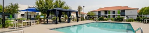 Mesa Apartments for Rent - Mesa Station - Sparkling Pool with Lounge Seating, Umbrellas, and Picnic Tables
