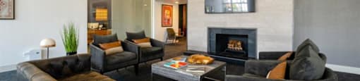 a living room filled with furniture and a fire place