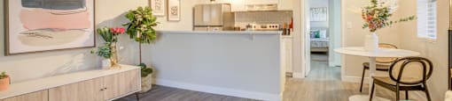 the living room and kitchen of an apartment