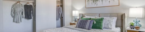 One-Bedroom Apartments in North Mountain Village, Phoenix, AZ - Ardella on 28th - Furnished Bedroom with Carpet Flooring and a Large Closet with Storage Shelf