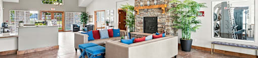 Spokane, WA, Apartments with In-Unit Washer and Dryer - Deer Creek Apartments - Resident Lounge With A Large Sectional Sofa And High Ceilings.