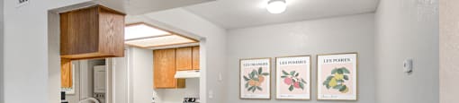 a dining room with a table and chairs and a kitchen