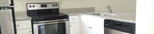 39th Avenue apartments in Gainesville, FL photo of updated kitchen with stainless steel appliances