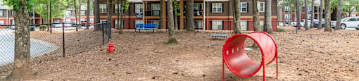 Pet park with agility features at Flats at River View apartments in Duluth, GA, near Lawrenceville.