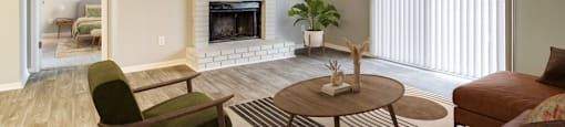 Living room with cozy fireplace at Forest Glen apartments in Austell, GA 30106, near South Cobb County and Douglasville.