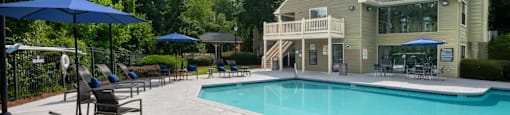 Swimming pool with lounge seating at Forest Glen apartments in Austell, GA 30106, near South Cobb County and Douglasville.