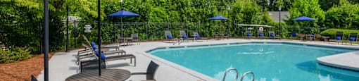 Resort-style pool area featuring comfortable lounge chairs at Forest Glen apartments in Austell, GA 30106, near South Cobb County and Douglasville.