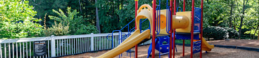 Playground with safe play structures at Forest Glen apartments in Austell, GA 30106, near South Cobb County and Douglasville.