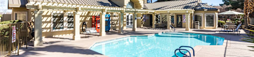 Paradise Las Vegas NV Senior Apartments with In-Unit Washer and Dryer | Gramercy Parc | Exterior Shot of the Pool Featuring Lounge Chairs