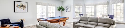 A living room with a pool table and a couch.
