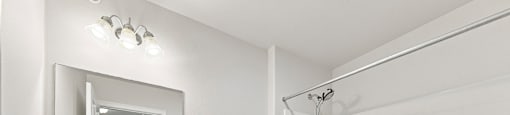 A white bathroom with a sink, toilet, and bathtub.