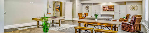 a living room with tables and chairs and a dining table at LIV at Boerne Hills an Active Senior Community 62+, Boerne, TX, 78006