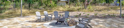 a patio with chairs and a fire pit at LIV at Boerne Hills an Active Senior Community 62+, Boerne