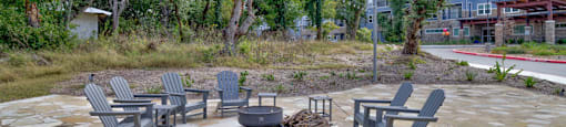 a patio with chairs and a fire pit at LIV at Boerne Hills an Active Senior Community 62+, Texas, 78006