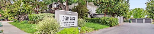 Apartments for Rent in Fremont, CA - Logan Park - Exterior View of Logan Park Apartment Building with Lush Landscaping.