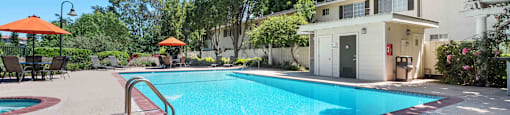 Apartments for Rent in San Jose, CA - Los Gatos Creek - Pool and Spa with Lounge Chairs, Tables and Chairs, Umbrellas, and Beautiful Landscaping