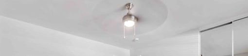 Townhomes for Rent in San Jose, CA - Los Gatos Creek - An Empty Bedroom with Light Gray Walls, Carpet Flooring, Ceiling Fan with Lighting, and Oversized Closet with Sliding Mirrored Doors.