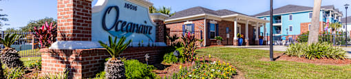 A sign that says Oceanaire in front of a building.