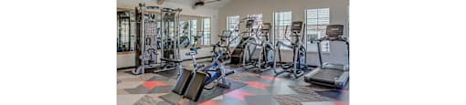 Tigard Apartments-Sygnii-Fitness Center with Equipment, Overhead Lighting, Mirrors, and Windows