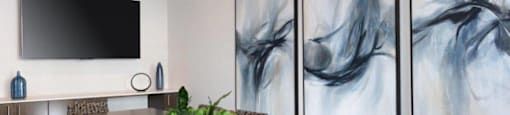 Santa Clara, CA, Apartments Near Valley Fair Mall - Santana Terrace - A Conference Room Featuring a Long Meeting Table and Large Abstract Artwork on the Wall.