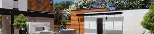 Two-Bedroom Apartments in Santa Clara, CA - Santana Terrace - Swimming Pool with a Fireplace, Lounge Seating, and Lush Landscaping