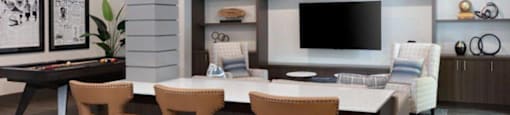 Apartments Near Santan Row in Santa Clara, CA - Santana Terrace - Game Room with a Pool Table, a TV, and Comfortable Seating