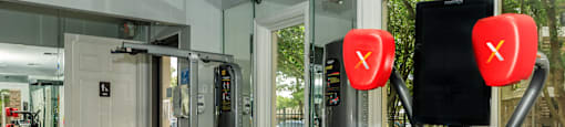 State-of-the-art fitness center with modern equipment at Sagewood at Westchase apartments in Houston, Texas.