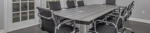 Business center with sophisticated clubhouse and seating at Sagewood at Westchase Houston TX for residents’ convenience