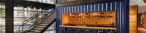 A blue container is used as a bar in The Laura community lounge.