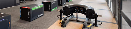 A gym with a view of the outside through the windows.