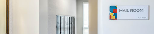 a hallway with a mail room sign on the wall